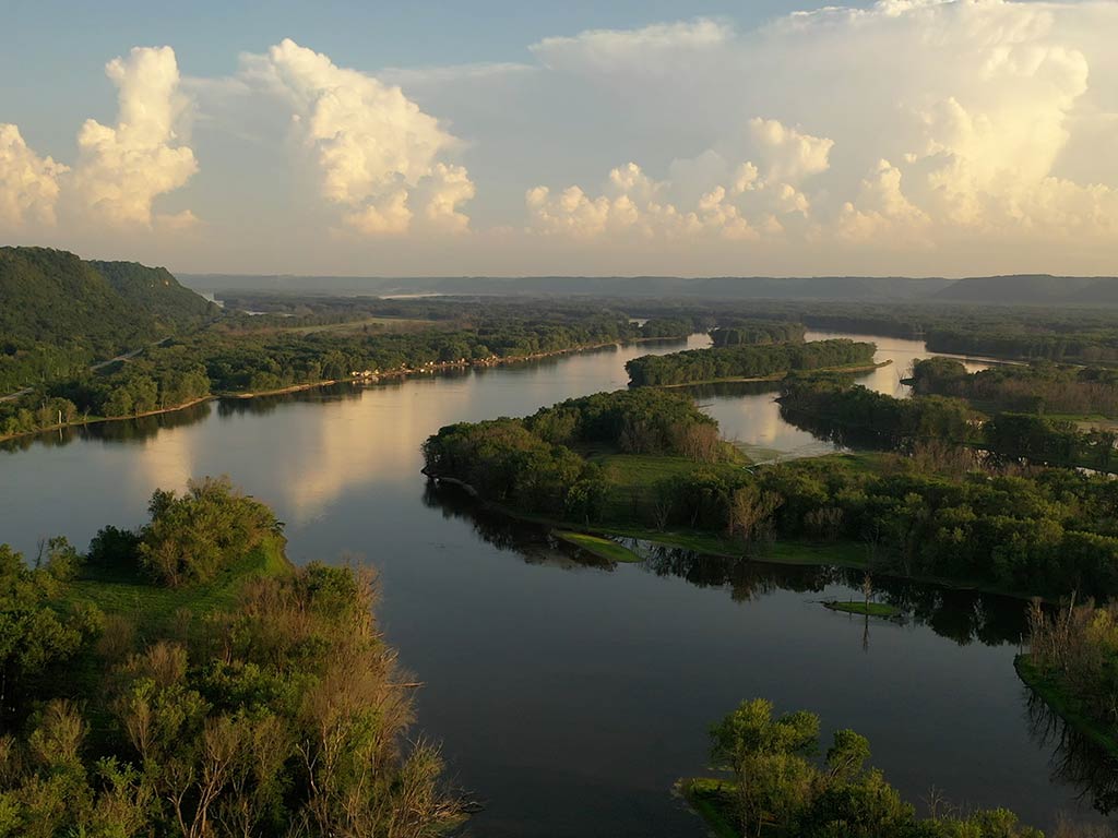 An aerial view of the Mississippi River as it bends through Iowa on a bright summer's day