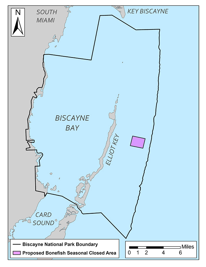 A map displays the boundary of Biscayne National Park, with a highlighted area marking the proposed seasonal Biscayne Bay Bonefish Closed Area near Elliott Key, Florida. The map includes a scale in miles for reference. All text labels clearly show fish and species’ names—such as BONEFISH—in capital letters to ensure readability and emphasis.