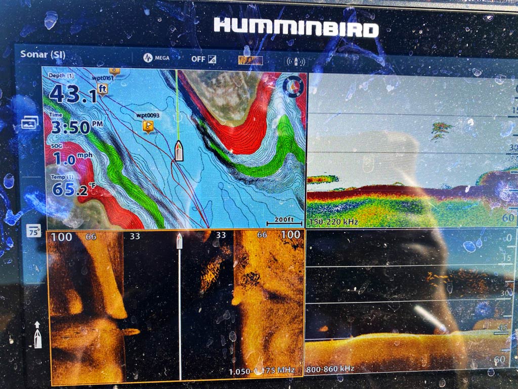 A closeup of a front-facing sonar being used on a lake in Arkansas to find fish and bait. 