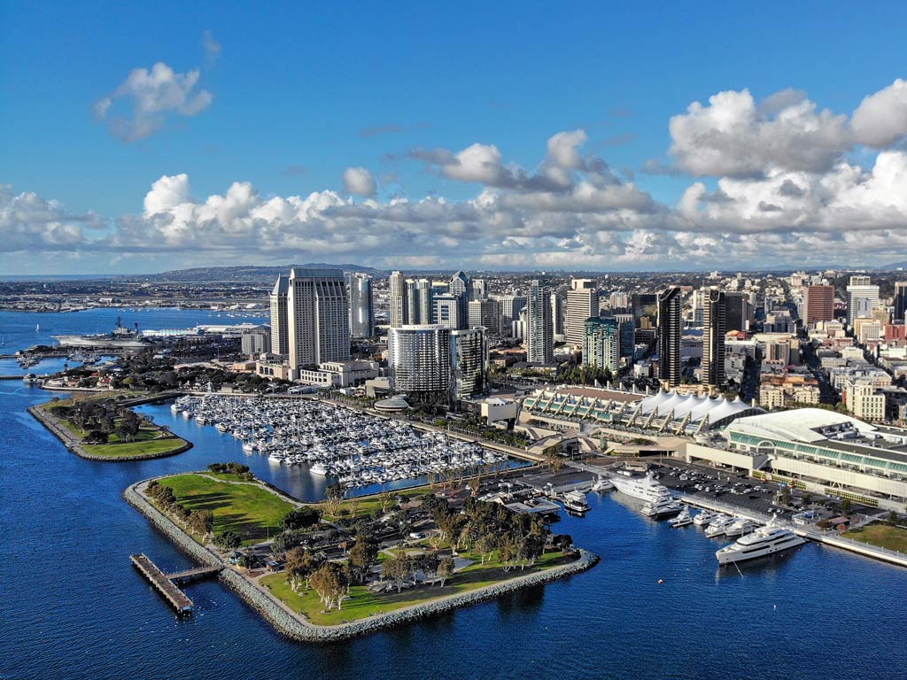 An aerial photo featuring San Diego Bay in all its glory and beauty on a sunny day; San Diego is one of the best US fishing cities 
