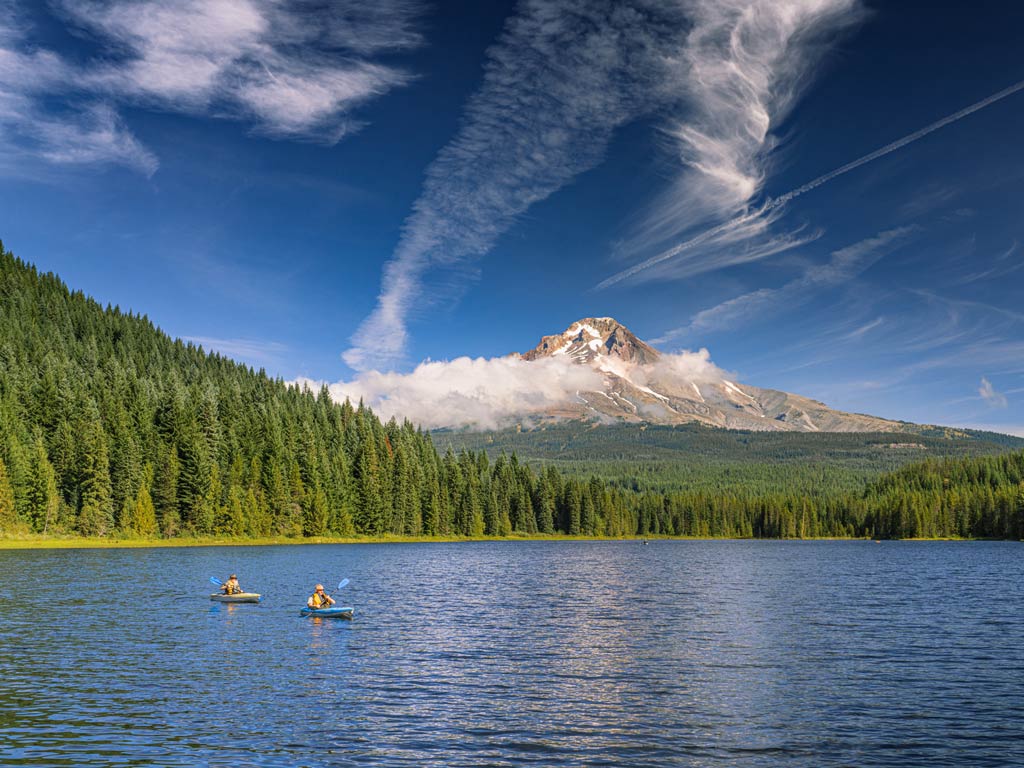 A photo featuring Mount Hood as seen from a lake near Portland – one of the best US fishing cities.