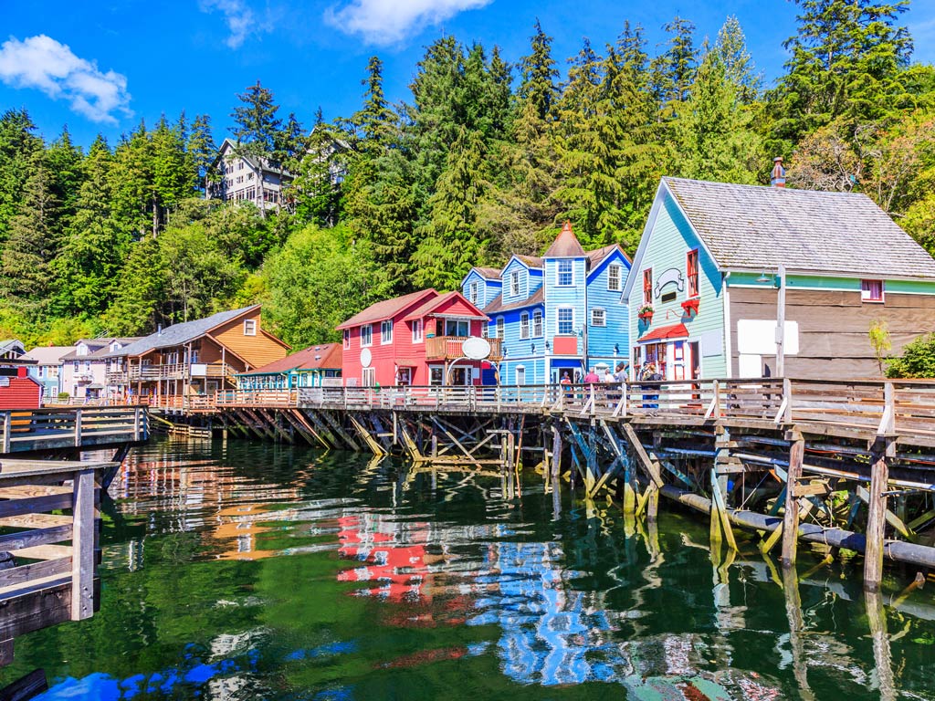 Creek Street in Ketchikan, Alaska is a historic boardwalk built on stilts over Ketchikan Creek, known for its colorful buildings, rich gold rush past, and scenic waterfront views.